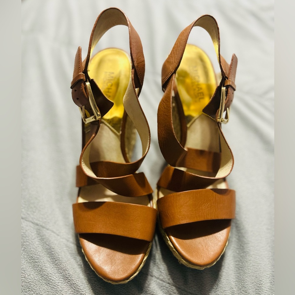 Super cute pair of Michael Kors tan wedge heels. Perfect for spring/summer!